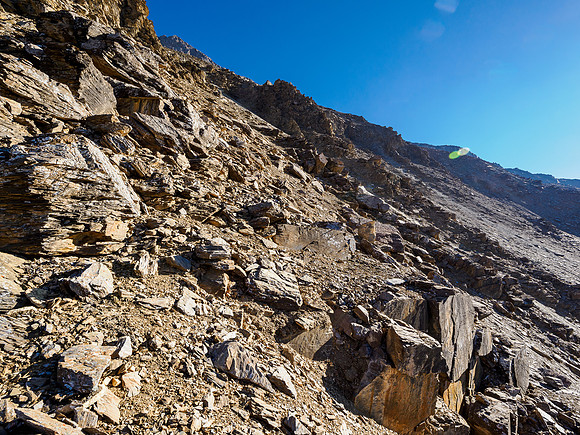 Once the SW slope transitioned to scree and rubble I traversed back to climber's left on easy terrain