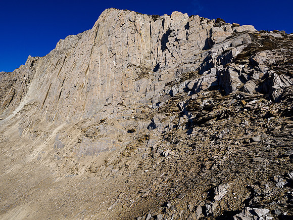 Views back to the summit cliffs with the easy SSE ridge at right.