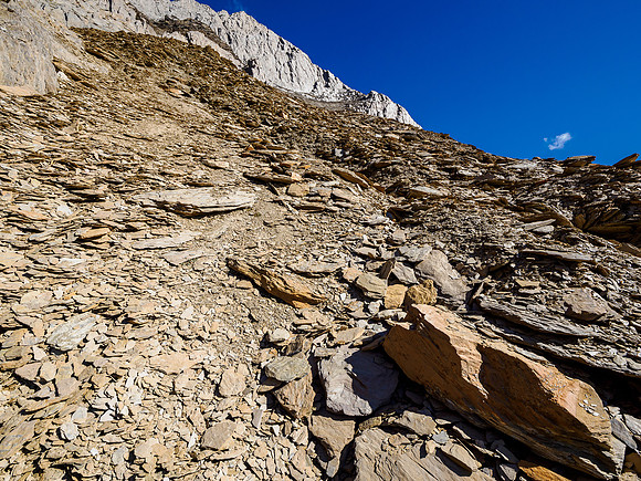 Views back up to the traverse and escape route from the SW face high above now.
