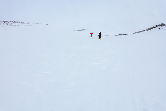 Skiing up wind hammered snow on the south ridge.