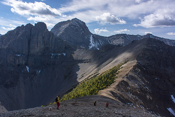 Losing elevation before gaining the high point of the traverse.