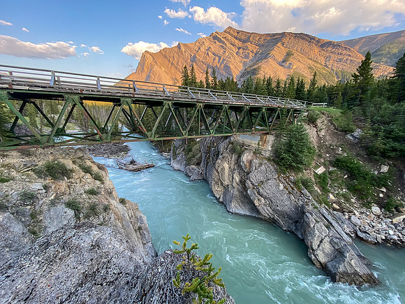 The Red Deer River flows under an old bridge along the Cascade fire road. Mount White in the bg.