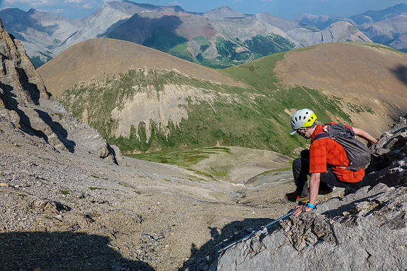 Downclimbing the slabs and low cliffs on the east face.