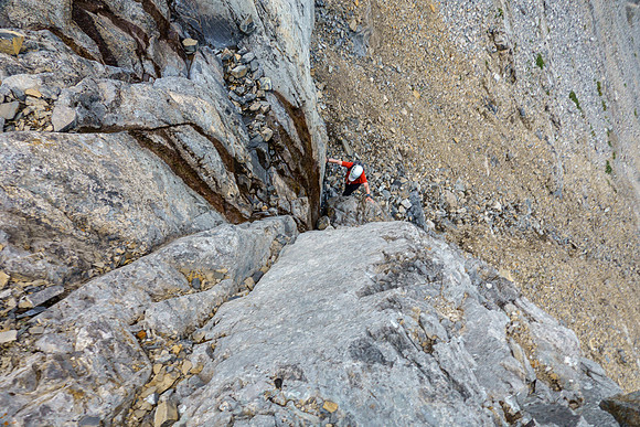 Scrambling up slabs and scree on the east face of Tyrrell.