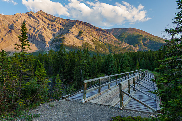 The Red Deer River flows under an old bridge along the Cascade fire road. Mount White in the bg.