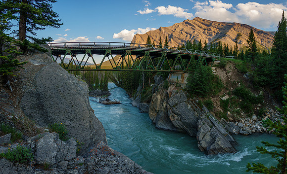 The Red Deer River flows under an old bridge along the Cascade fire road. Mount White in the bg.