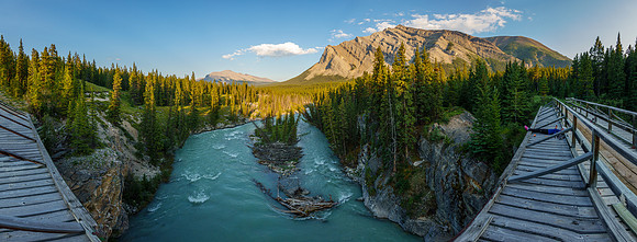 The Red Deer River flows under an old bridge along the Cascade fire road.