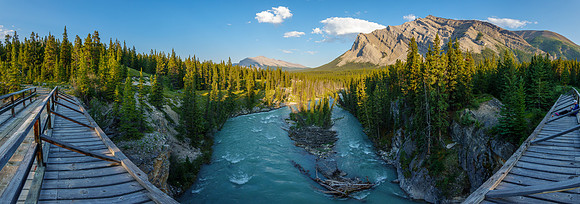 The Red Deer River flows under an old bridge along the Cascade fire road.