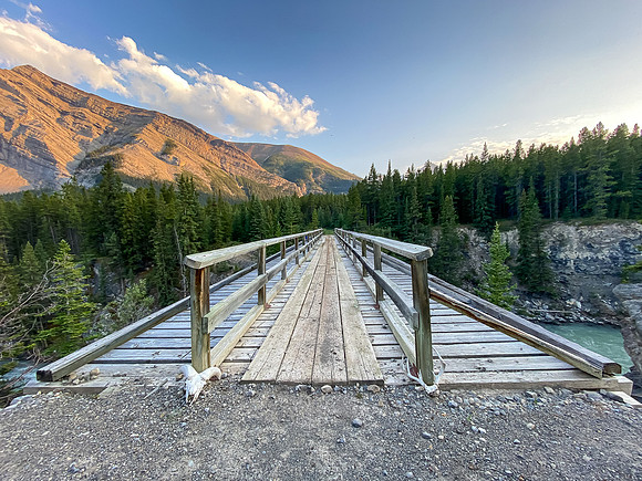 The Red Deer River flows under an old bridge along the Cascade fire road.