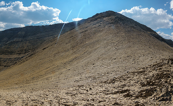 Descending the easy upper bowl back to the east face slabs.