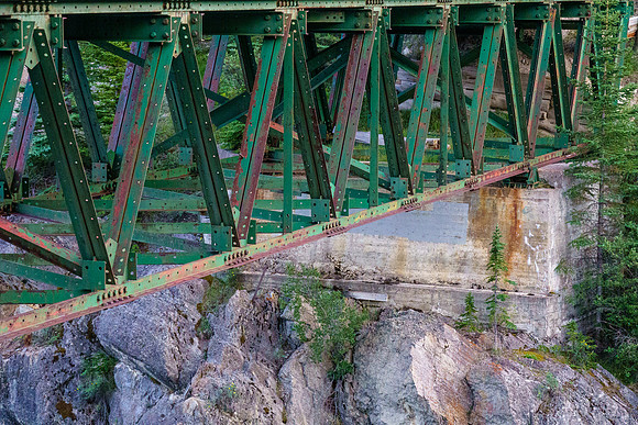 The Red Deer River flows under an old bridge along the Cascade fire road.