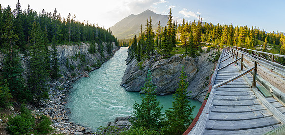The Red Deer River flows under an old bridge along the Cascade fire road.