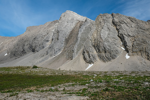Towering slabby peaks line this valley. None of them look easy.