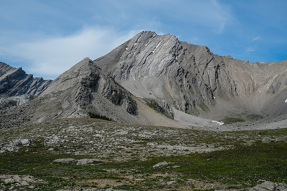 Towering slabby peaks line this valley. None of them look easy.