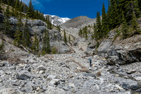 Approaching the upper south drainage where our route deviates east (R).