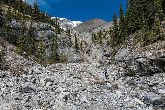 Approaching the upper south drainage where our route deviates east (R).