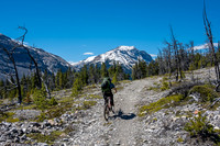 Phil bikes the last bit of our ride over the SE shoulder of Lost Guide.
