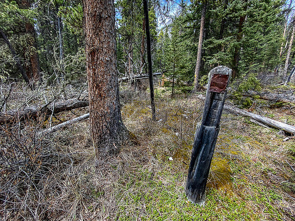 This old sign was near the cairn - not legible.