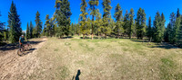 Biking through an abandoned outfitter camp.