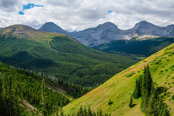 Views back from the access drainage to Cuthead Peak (L).