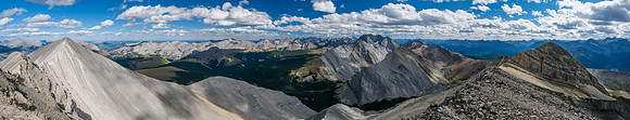 Summit views east and south to Otuskwan, Zombie and Puma. The east (L) and west (R) summits visible.