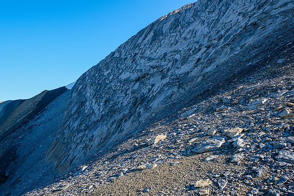 Steep slabby rock to the summit at right. We traversed north to try an easier line starting at snow.