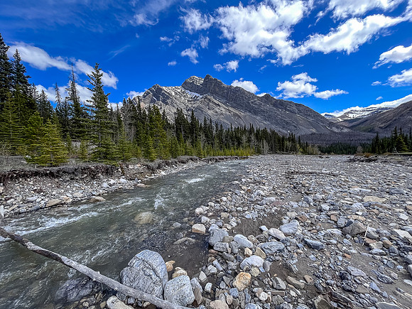 Hiking the Clearwater Trail from Indianhead Lodge to Malloch Meadows. Crossing Indianhead Creek.
