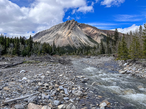 Hiking the Clearwater Trail from Indianhead Lodge to Malloch Meadows. Crossing Indianhead Creek.