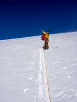 TJ points out his next objectives as we take a break on the way up the south ridge.