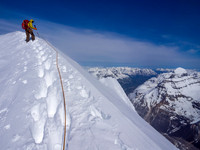 TJ on the final summit ridge of North Twin - note the nice drop to our right and Twins Tower visible at the center.