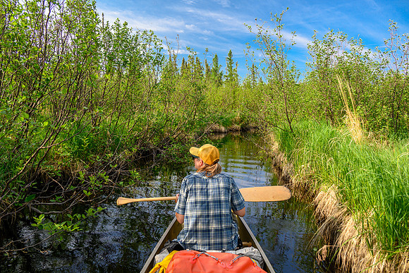 Traveling a small stream out of North Prairie towards Joey Lake.