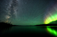 Aurora borealis (northern lights) and the Milky Way over Colin Lake.