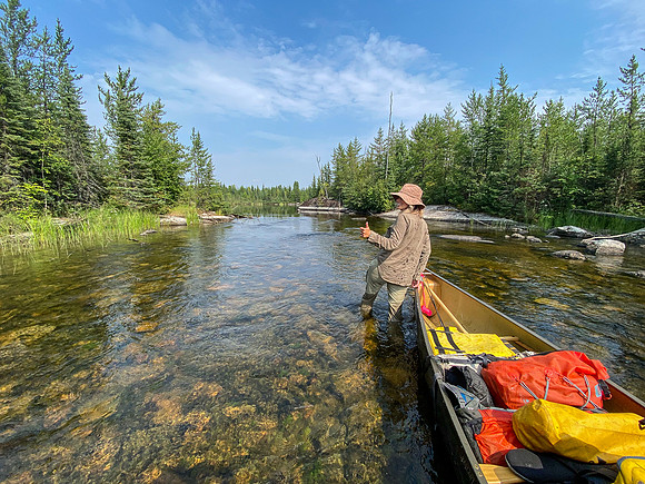 Navigating a rock garden along the Drinking River at the outlet of Soroski Lake.