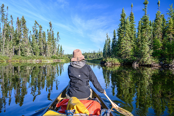 Paddling a calm Minuhik Lake.