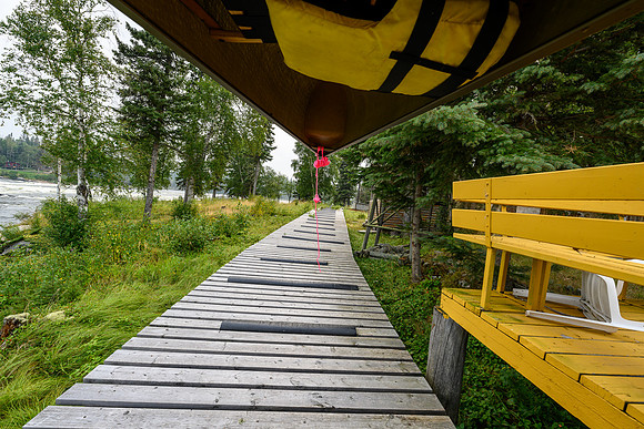 The portage around the class III+ / IV Potter Rapids is a rubber and wood sidewalk.