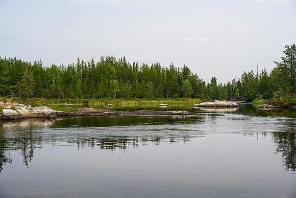 Navigating a rock garden along the Drinking River at the outlet of Soroski Lake.
