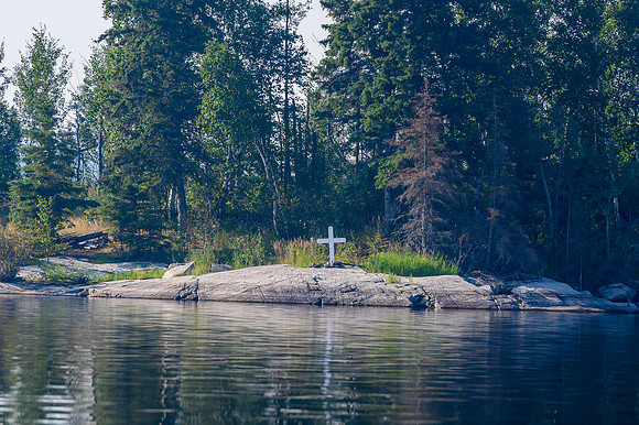 Lots of white crosses scattered along islands and shores of the Churchill River.