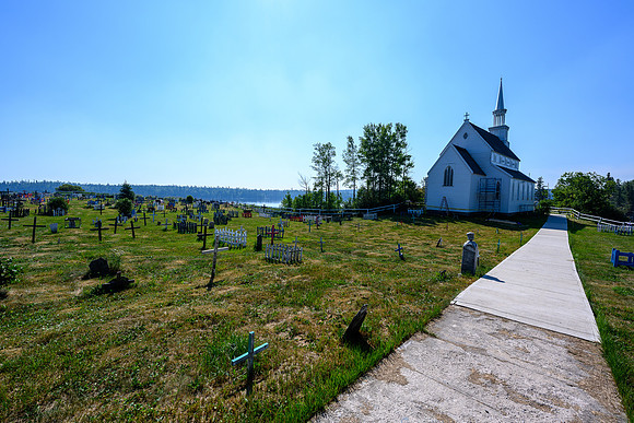 Touring the cemetery at the Stanley Mission church grounds.