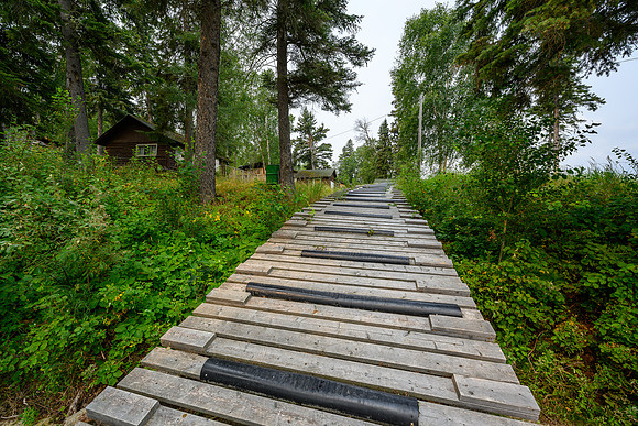 The portage around the class III+ / IV Potter Rapids is a rubber and wood sidewalk.