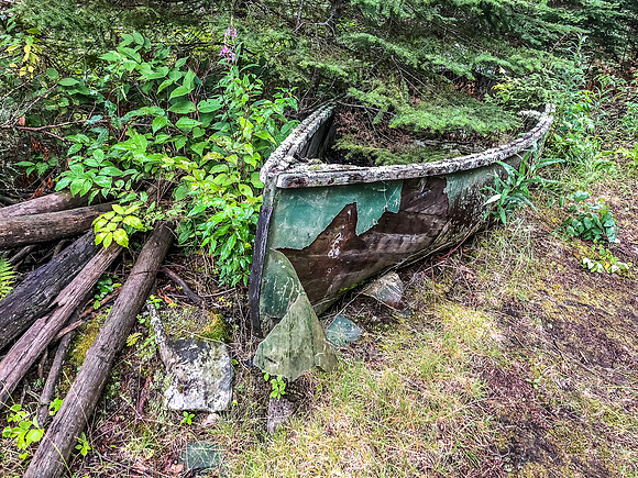 An old abandoned boat on the 30m portage along Douglas Creek.