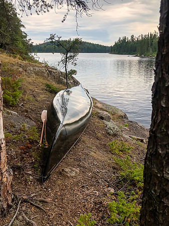 Back at Onnie Lake, canoe is stored and ready for storms.