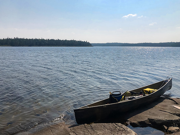 On the peninsula site in Upper Hatchet Lake taking a lunch break.