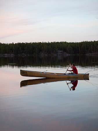 Bunny Lake is dead calm at 9:30pm on Friday night as Harold paddles back to camp with fresh fillets.