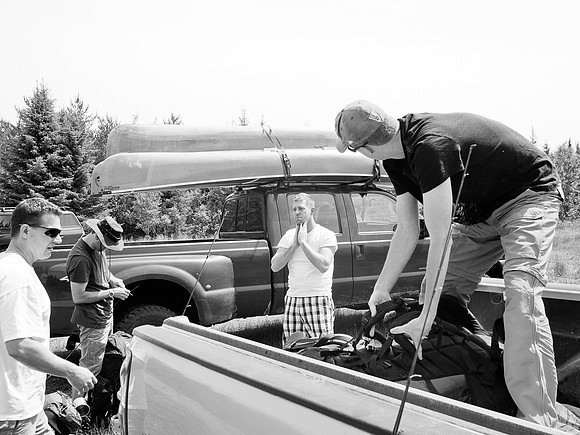 Unloading gear in the Leano Lake parking lot.