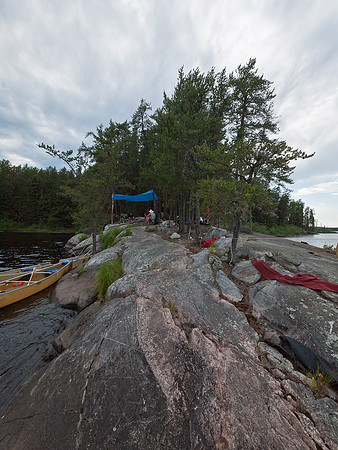 A view from the point looking back at our camp. Tents are behind the eating area, waterfall on left.