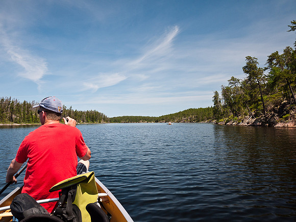 There is not a breath of wind as we paddle into Wrist Lake and look for a campsite.