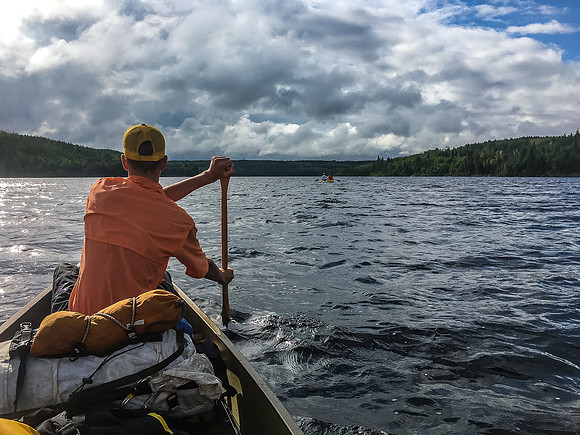 Paddling out of Upper Glenn Lake under some ominous looking skies.