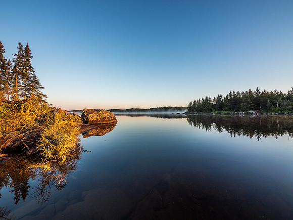 Morning mist rises over a lake of glass in this shot from our camp on Telescope Lake, early on Sunday morning.