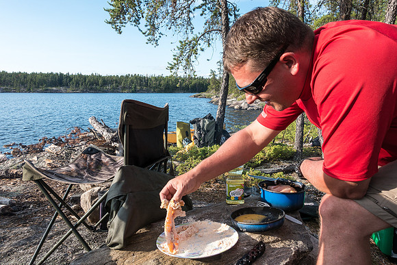 Harold prepares the fillets for frying.