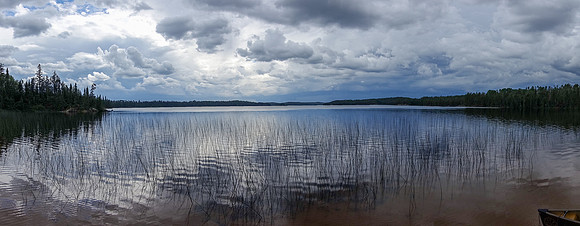 Looking at the impending storm from the end of the 1000m portage. Note how quiet the water is? That didn't last long!